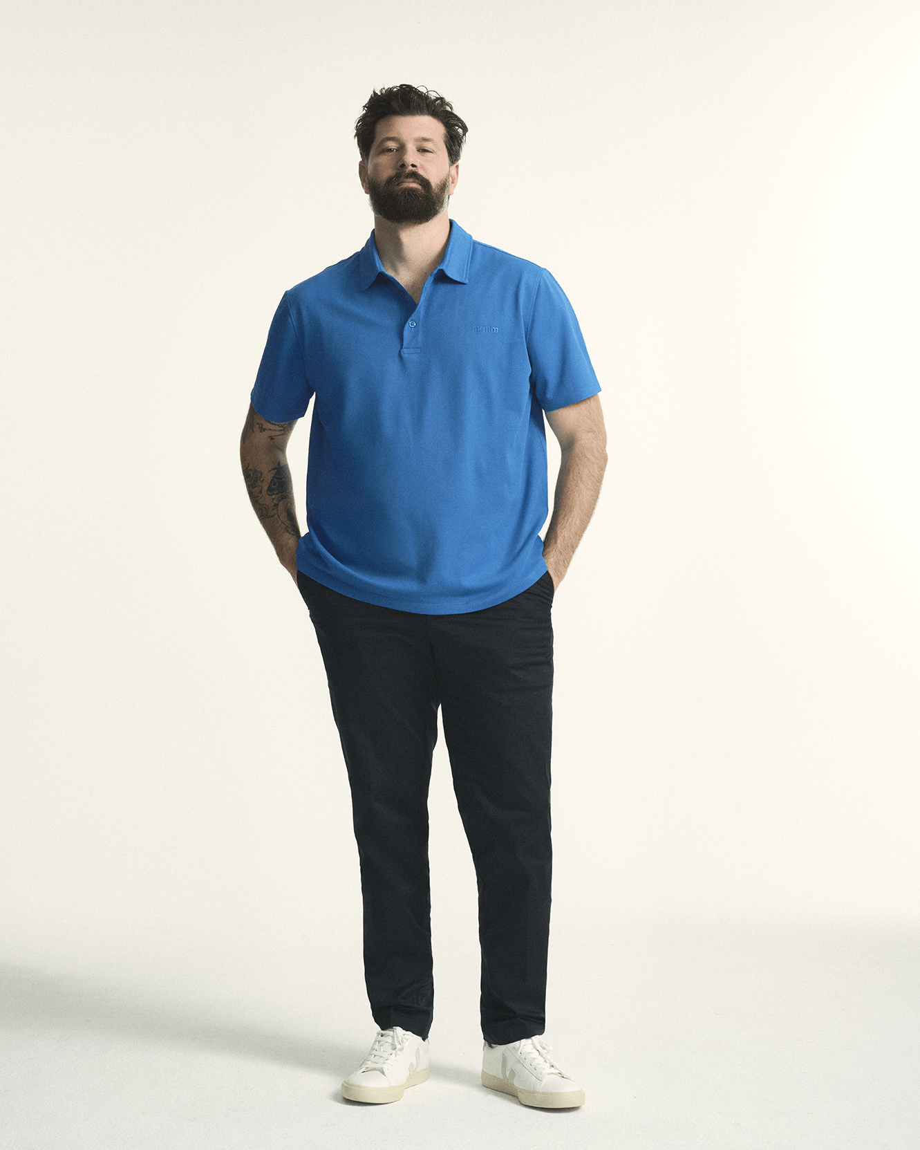 Model is wearing the plus size short sleeve mens breathable piqué polo in sizes XL-5XL, in bright blue