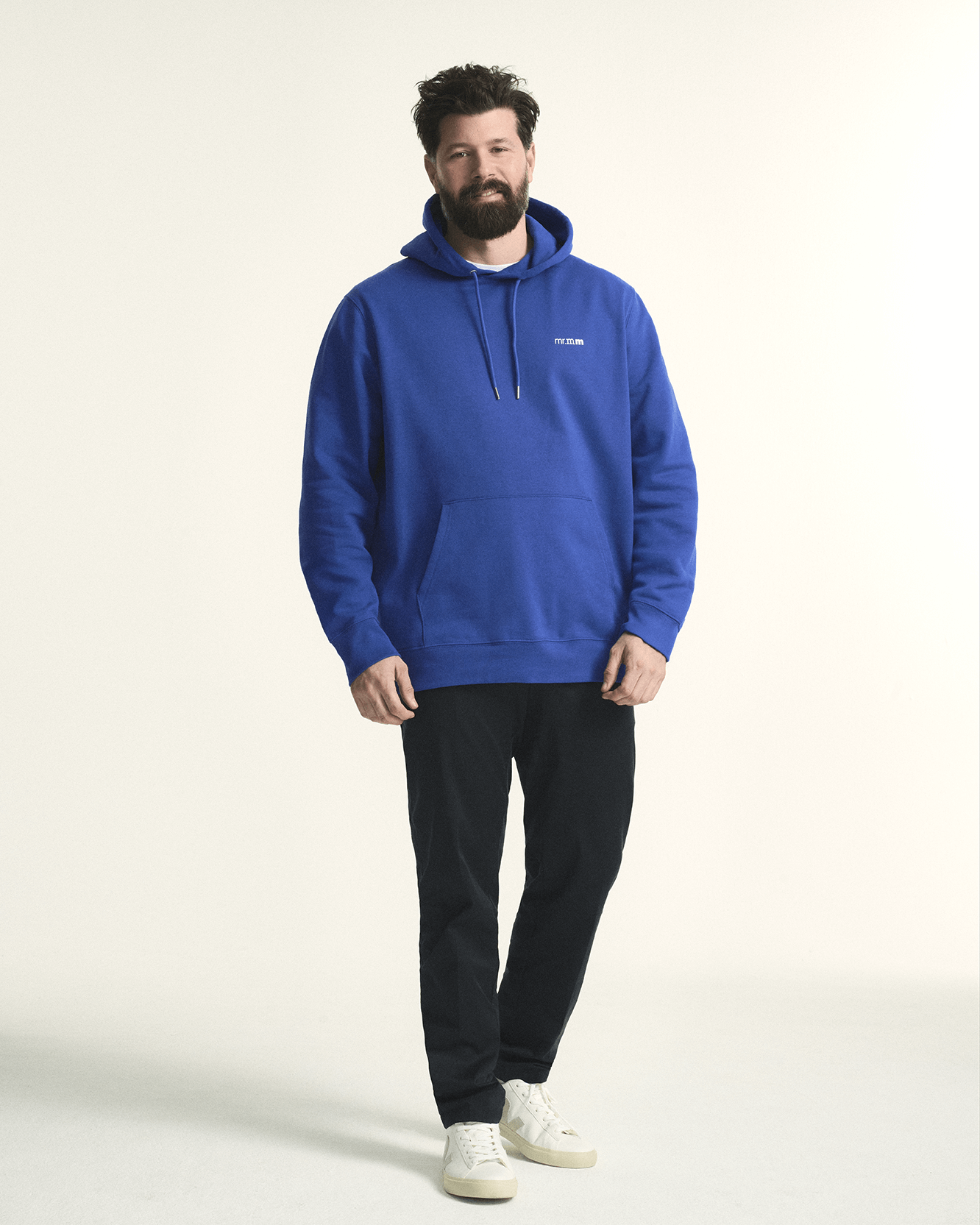Model is wearing The hoodie in bright blue, offering a relaxed fit and cozy fabric for plus-size comfort.