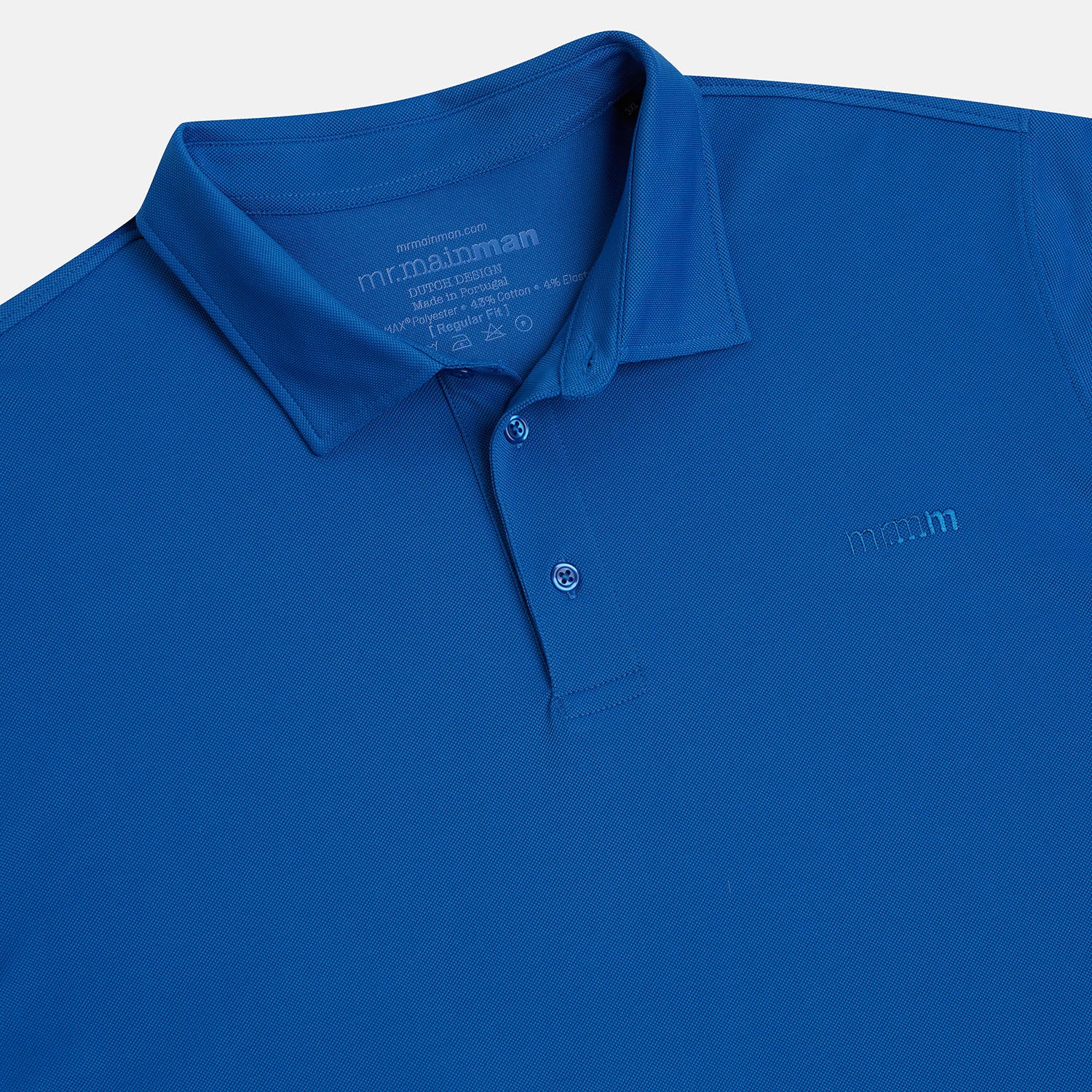 Button Collar detailed view of plus size short sleeve mens breathable piqué polo in sizes XL-5XL, in bright blue