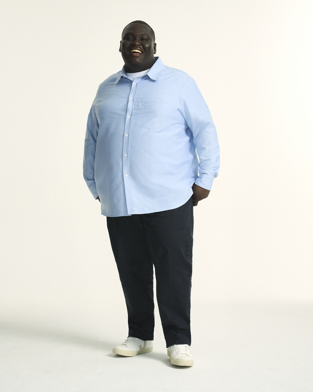 Model showcasing The Stretch Chino in navy, tailored for plus-size men with a comfortable elastic waistband