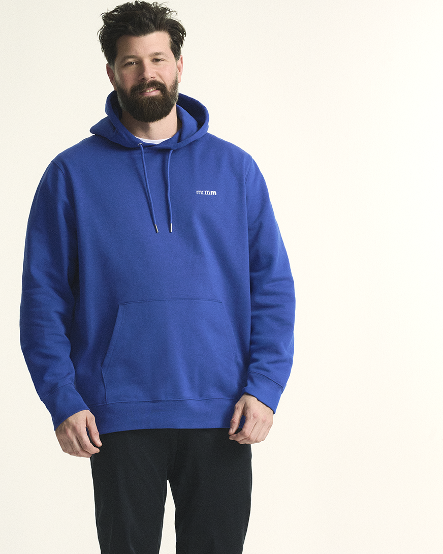 Model is wearing The hoodie in bright blue, offering a relaxed fit and cozy fabric for plus-size comfort.