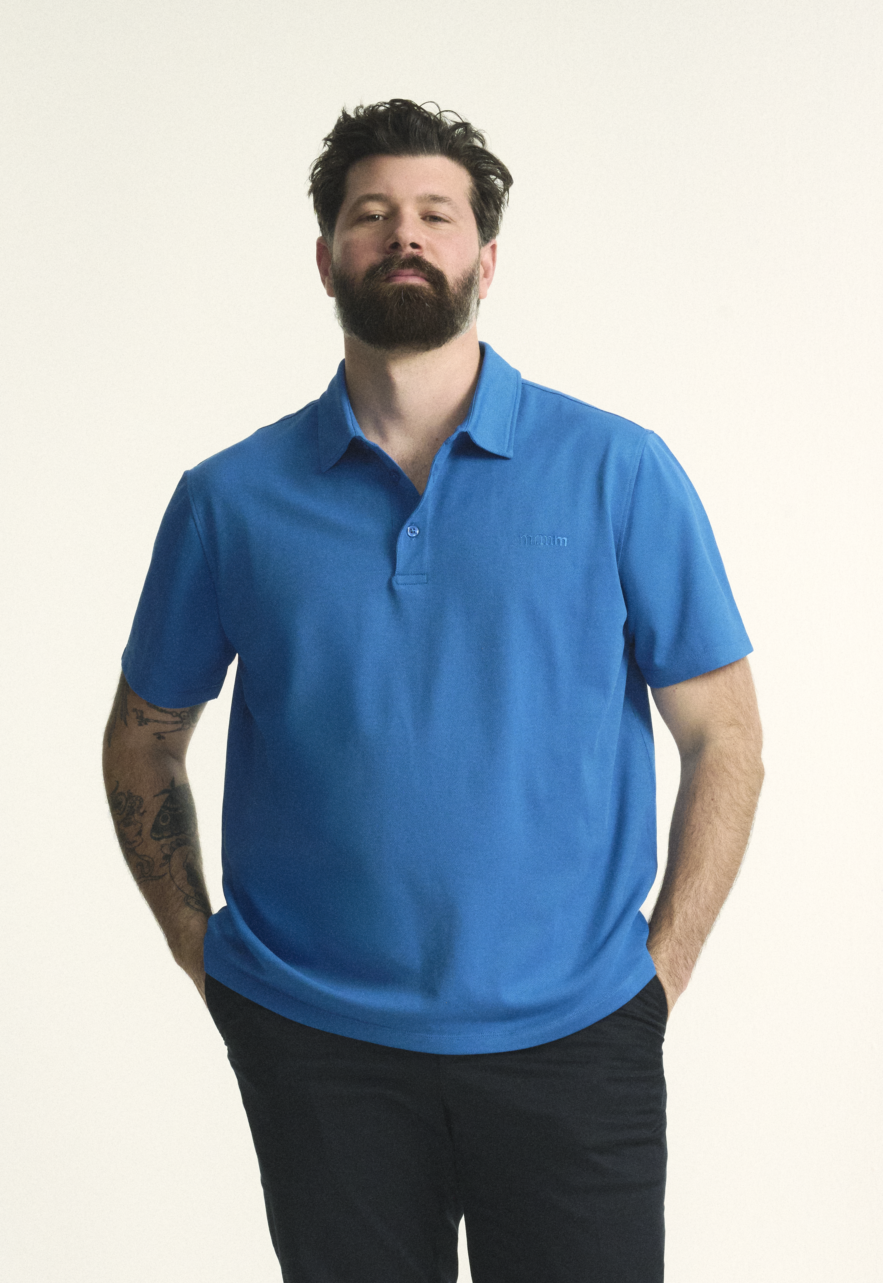 Model is wearing the plus size short sleeve mens breathable piqué polo in sizes XL-5XL, in bright blue