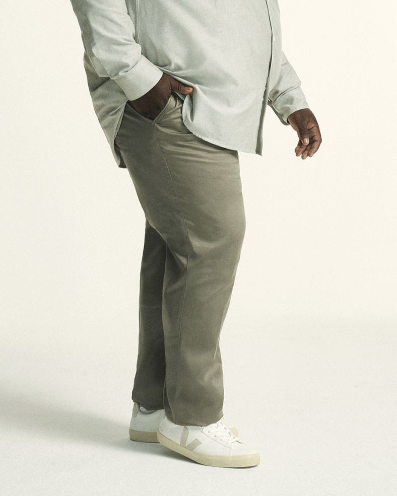 Model showcasing The Stretch Chino in khaki, tailored for plus-size men with a comfortable elastic waistband